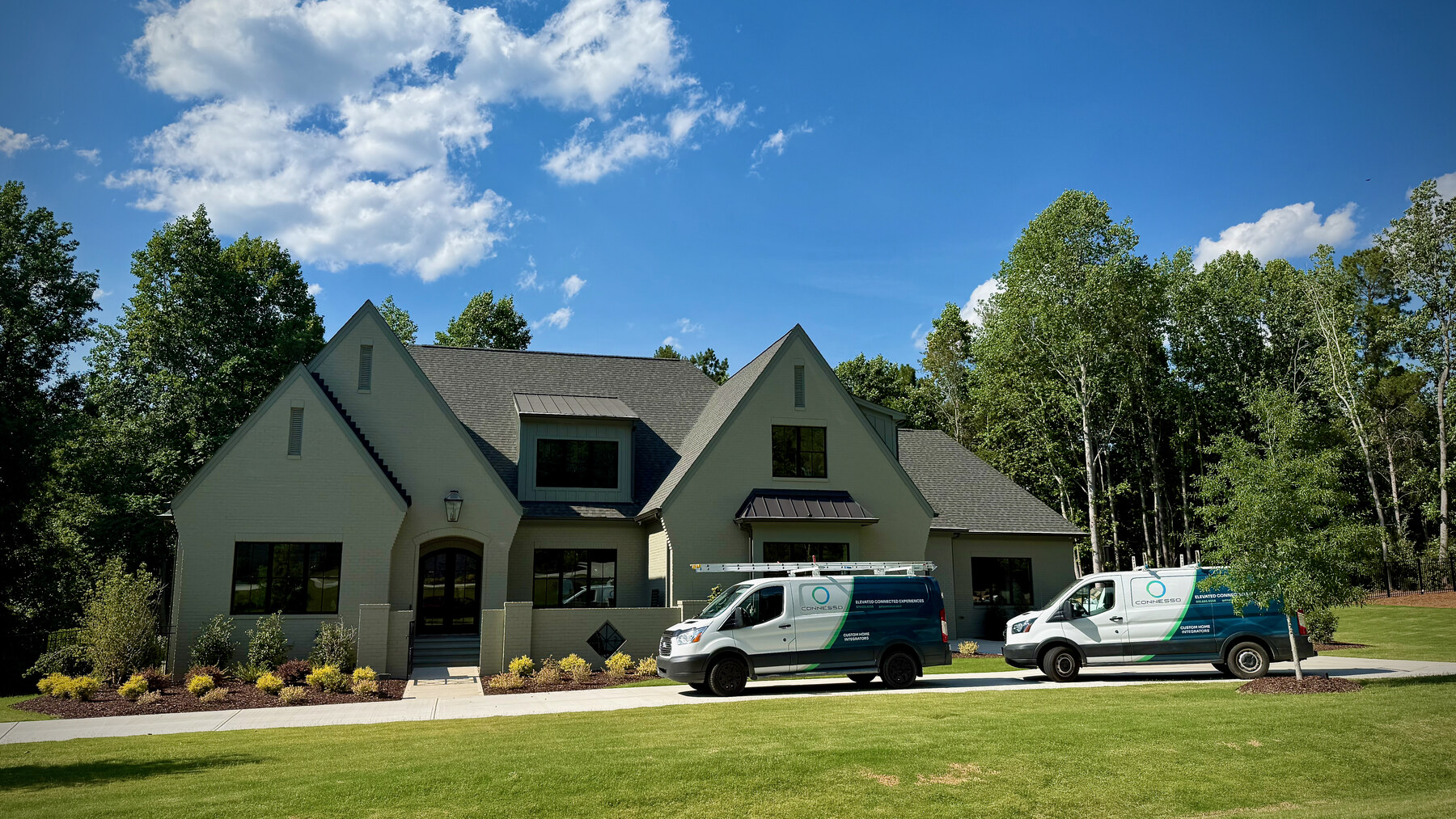 Connesso branded service vans at a custom home in Raleigh, NC