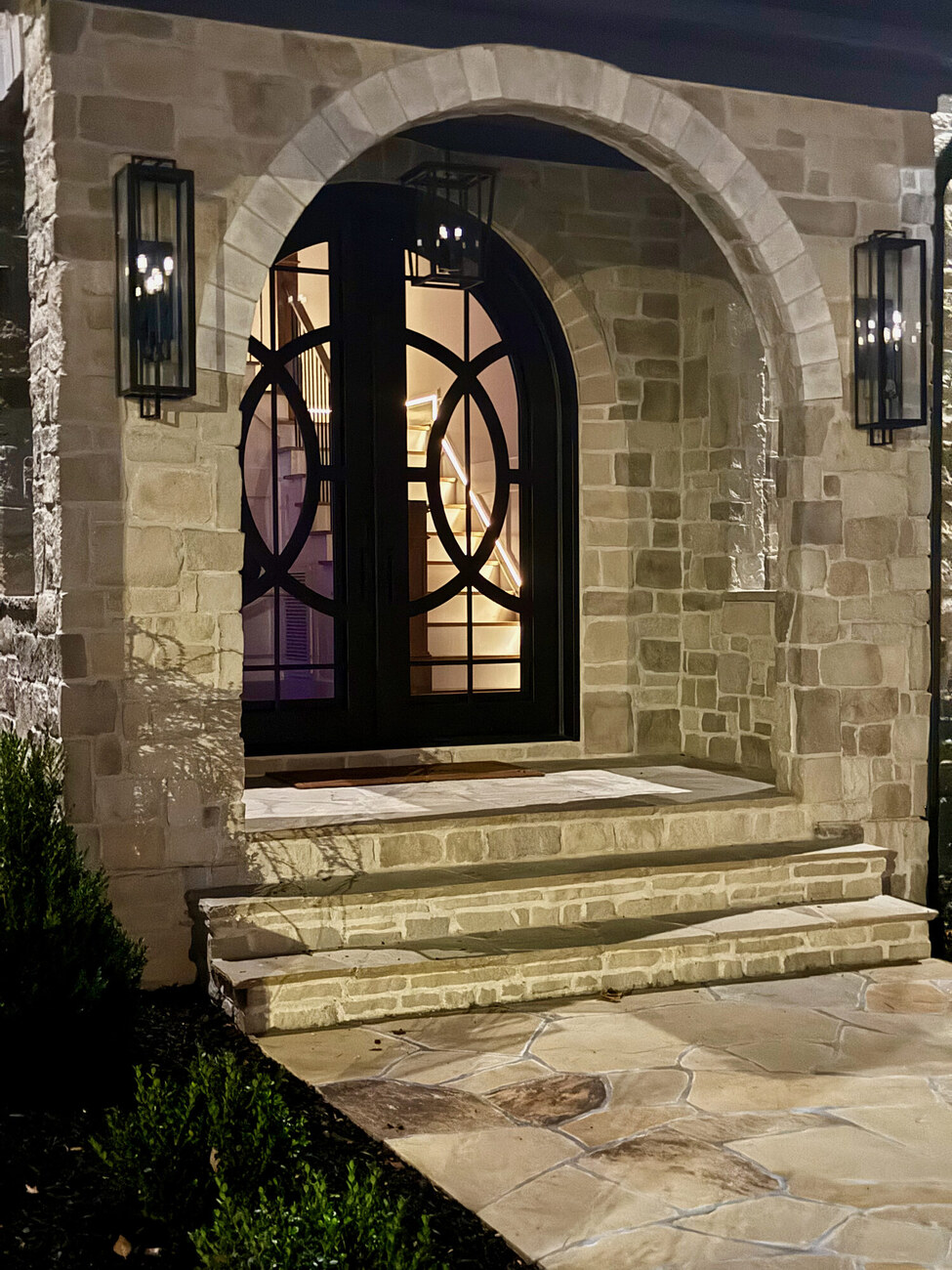 Illuminated stone entrance at night