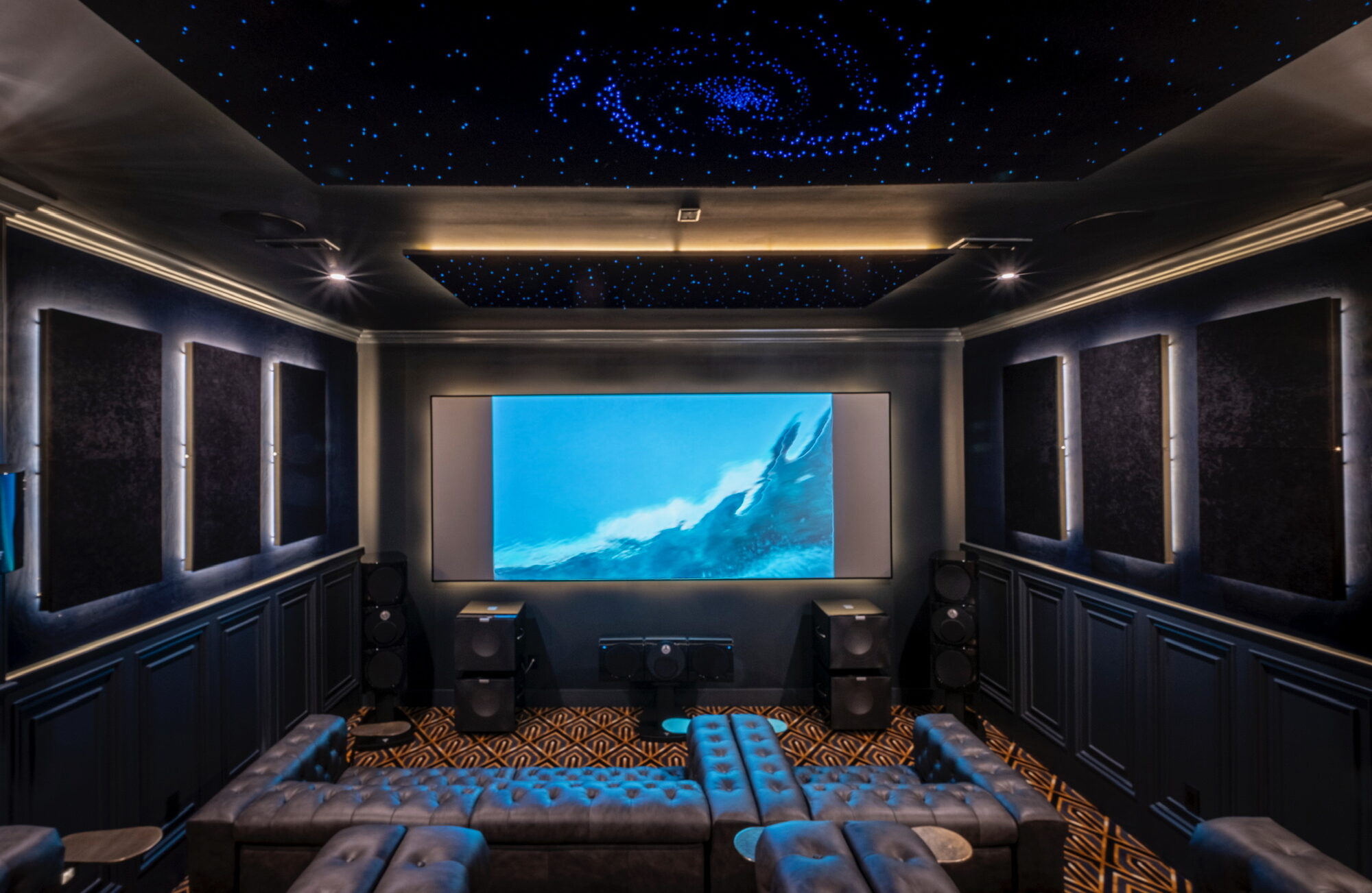 Dedicated home theater installation in Galena, Ohio with fiber-optic star ceiling, tiered leather seating, and acoustic panels