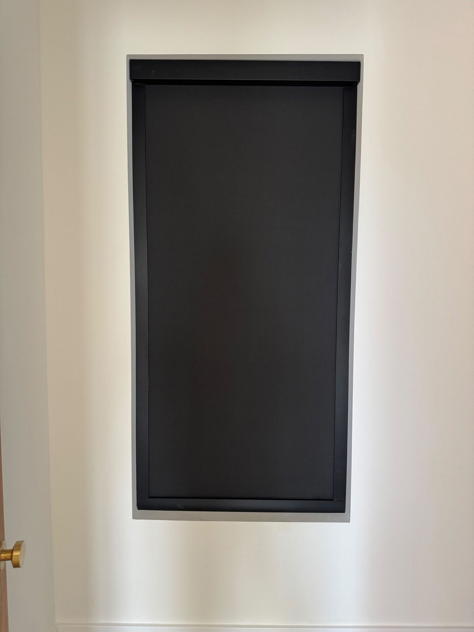 Recessed blackout roller shade lowered in a bedroom on a Josh.ai goodnight voice control scene