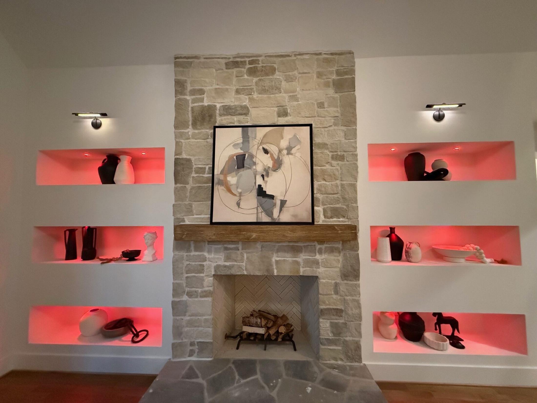 Stone fireplace with lit display niches on a Josh.ai welcome home voice control scene