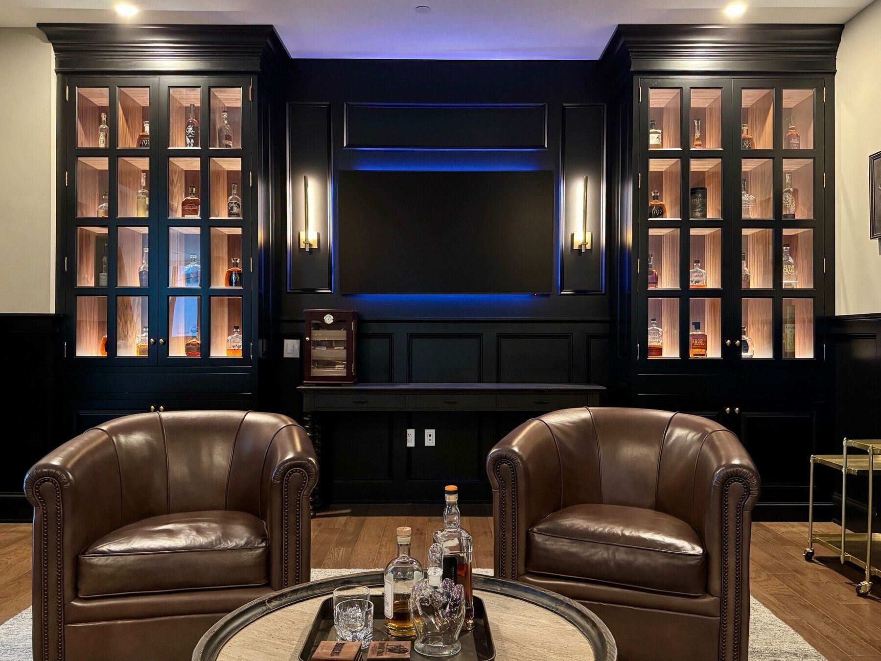 Backlit millwork lounge with warm accent lighting