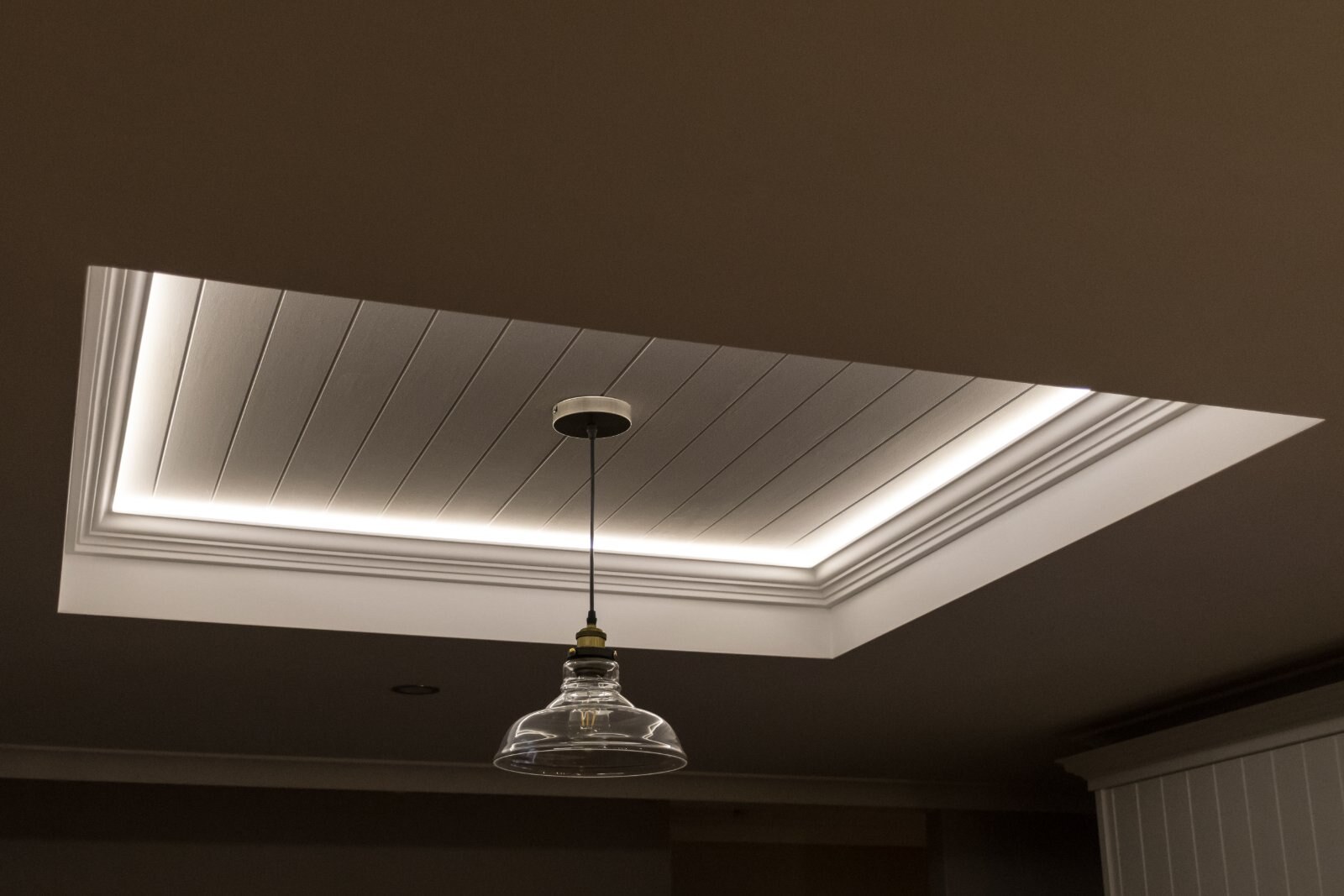 LED cove lighting in a beadboard tray ceiling