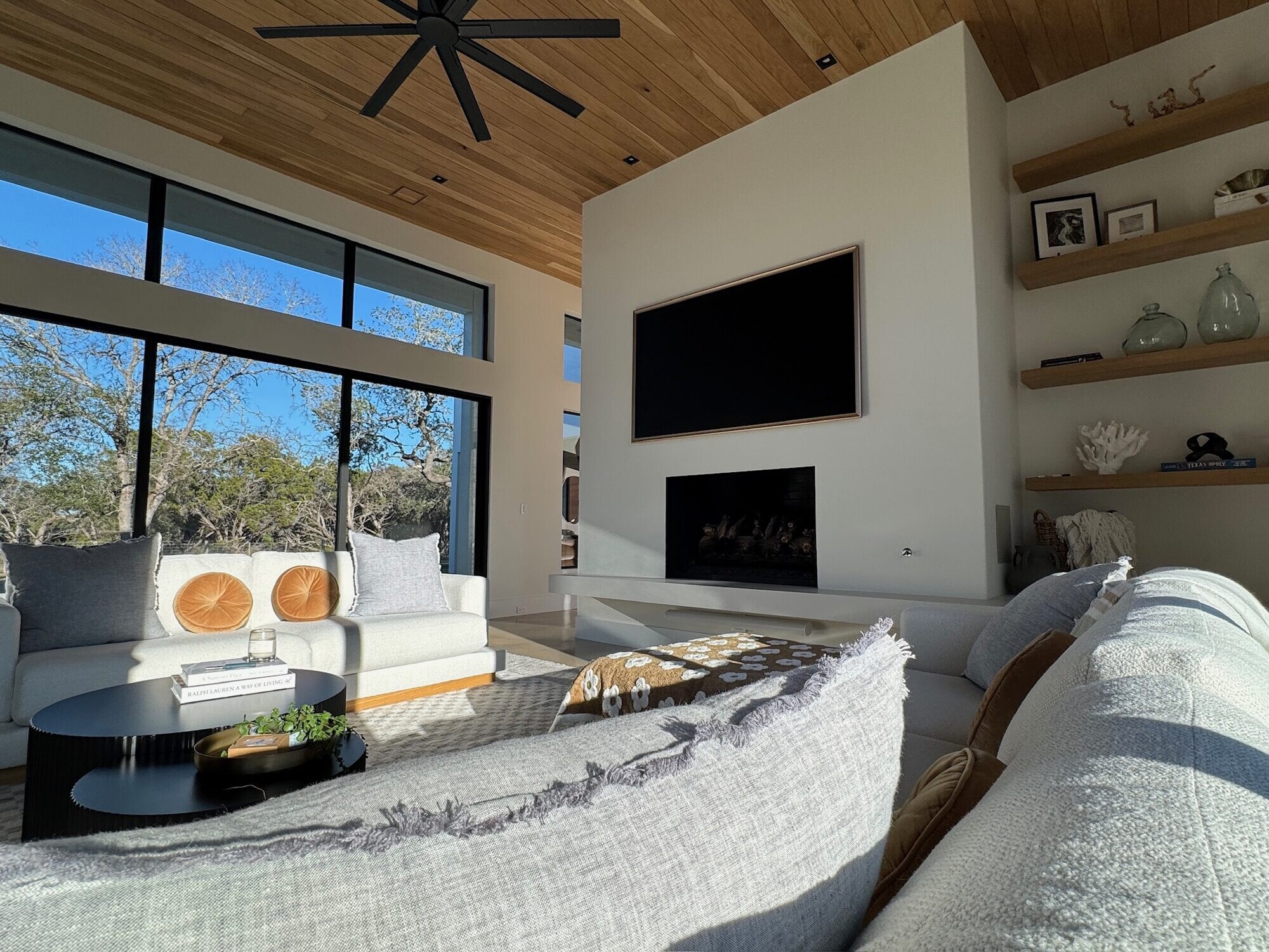 Luxury great room with integrated lighting, AV, and climate in a Raleigh estate