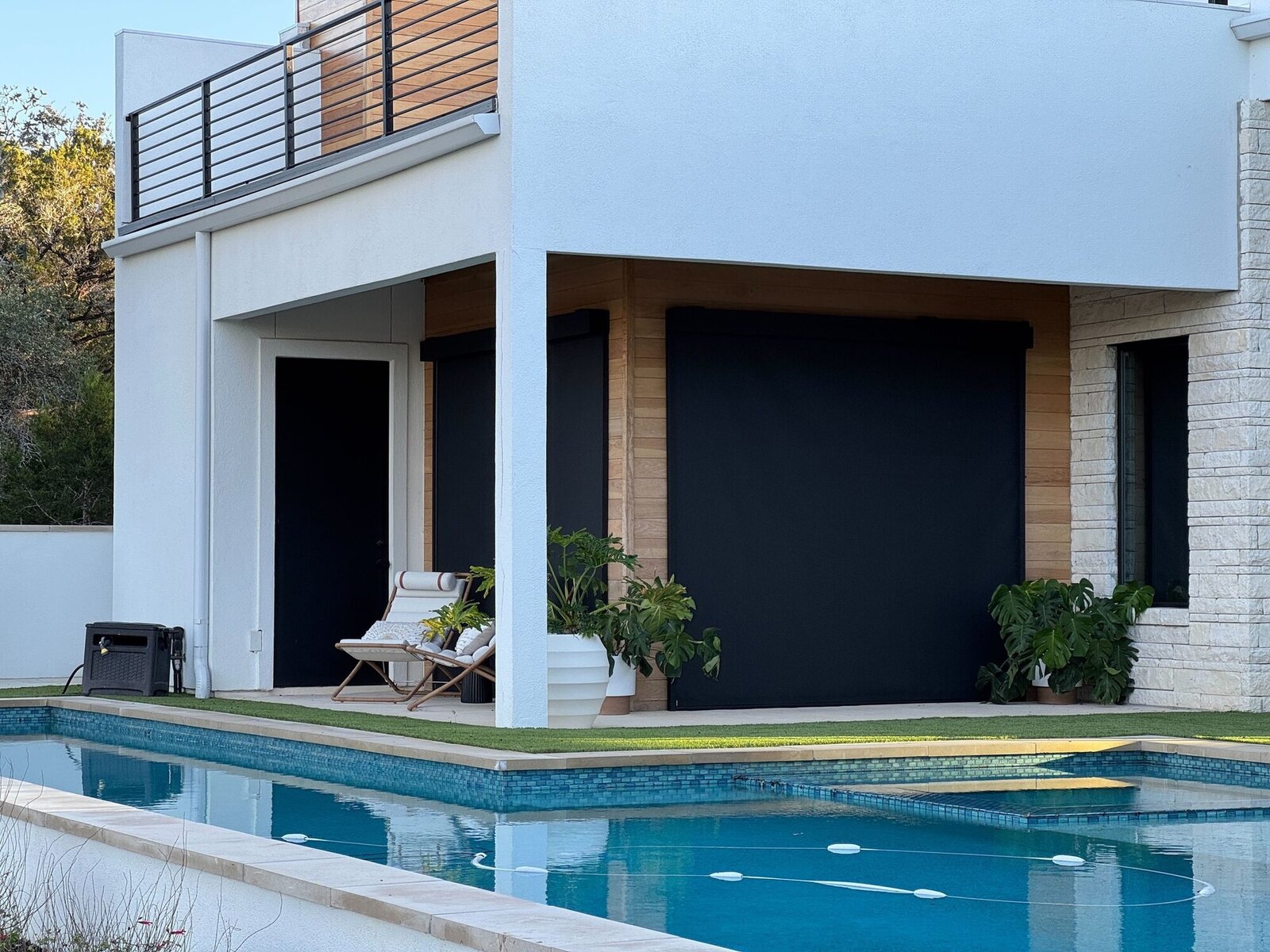 Motorized exterior shades lowered across a covered poolside living space, Morrisville NC