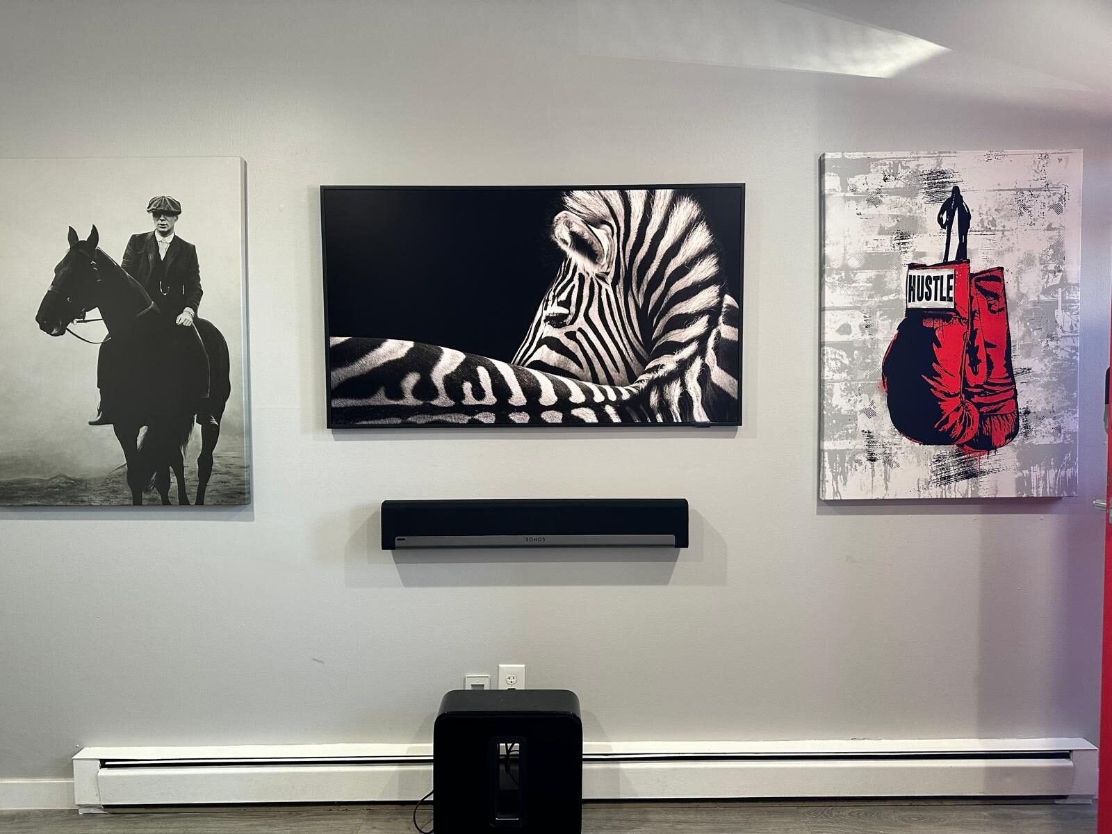 Samsung Frame TV in art mode with a Sonos soundbar and subwoofer, Hilliard OH